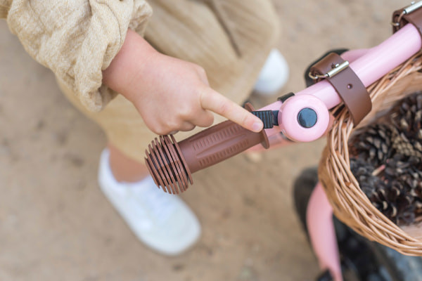 Optioneel: bijpassende roze bel