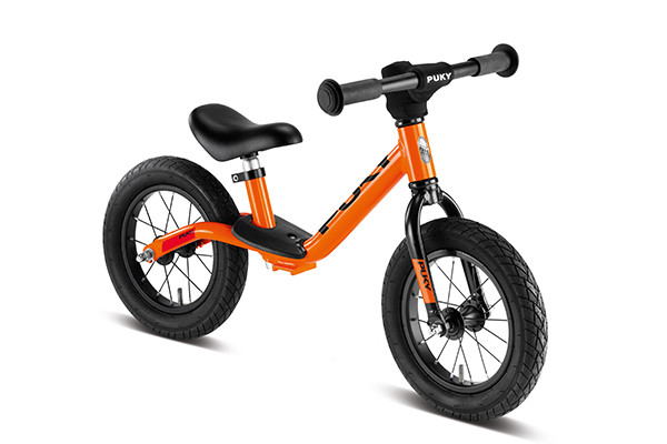 Puky oranje loopfiets.