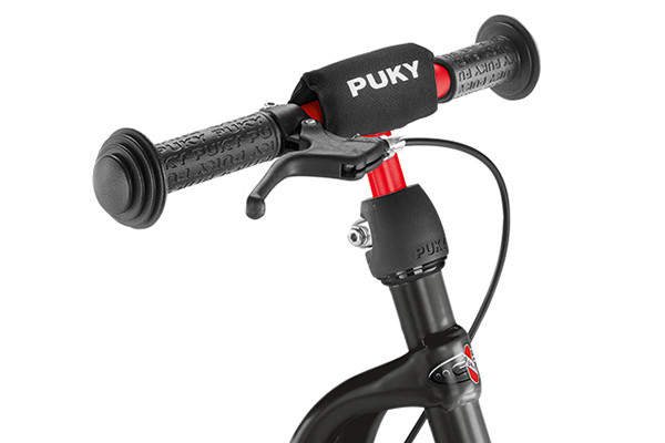 Voorzien van Puky kinbeschermer en een handrem.